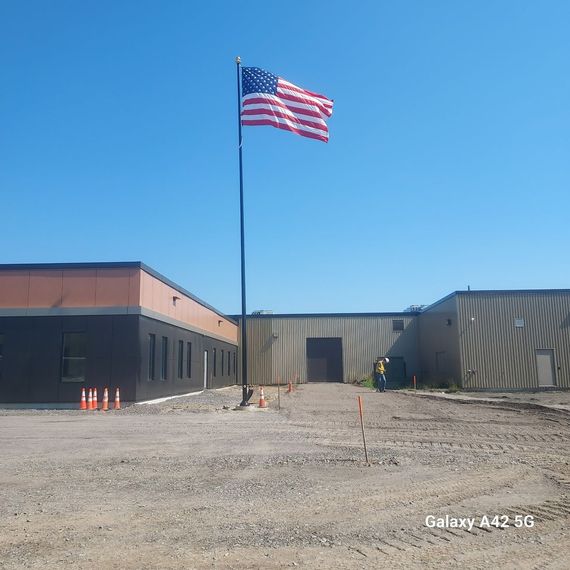 Commercial flagpole installed at a newly built business property